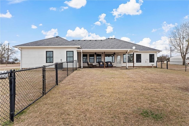 rear view of property featuring a patio area, a yard, an outdoor hangout area, and ceiling fan