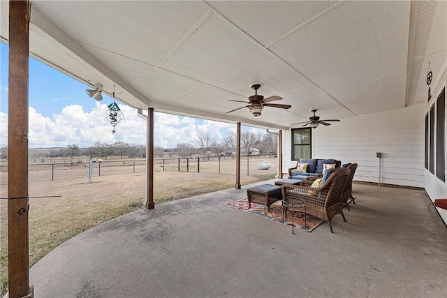 view of patio / terrace featuring a rural view, outdoor lounge area, and ceiling fan