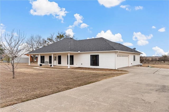 view of front of home featuring a garage and covered porch