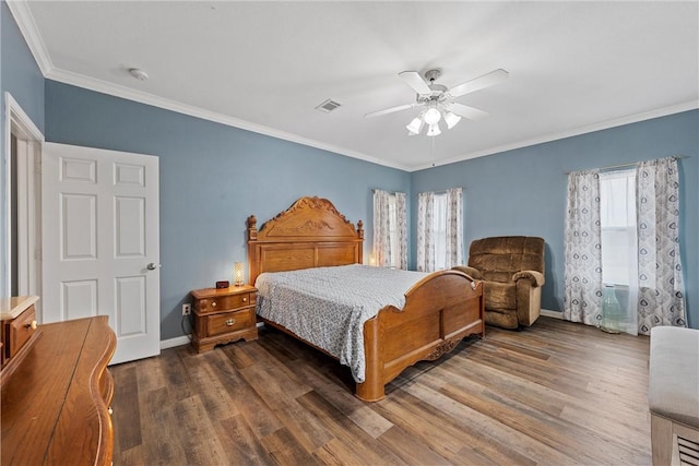 bedroom featuring ceiling fan, dark hardwood / wood-style floors, and crown molding