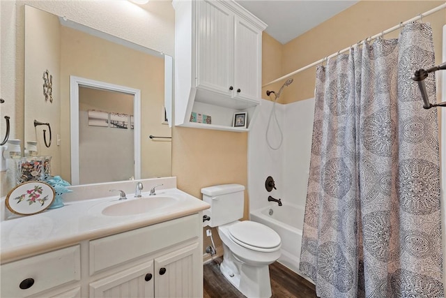 full bathroom with wood-type flooring, shower / bath combo with shower curtain, toilet, and vanity