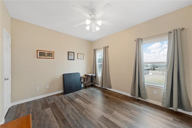 unfurnished room featuring ceiling fan and dark hardwood / wood-style flooring