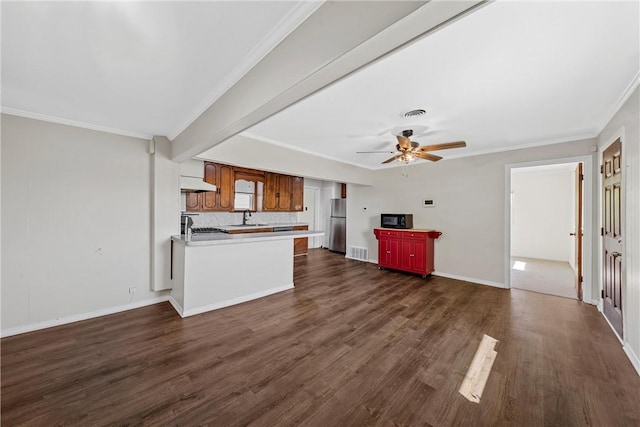 kitchen with sink, ornamental molding, dark wood-type flooring, and exhaust hood