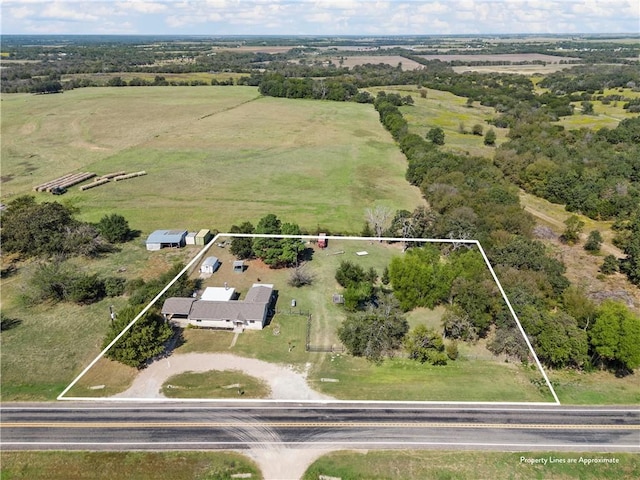 birds eye view of property with a rural view