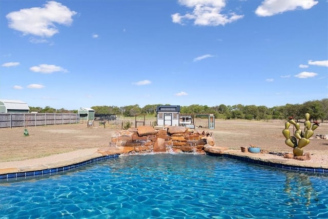 view of swimming pool with pool water feature