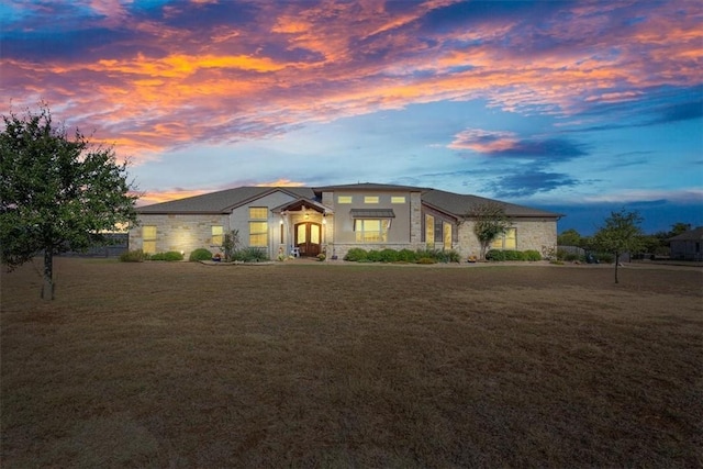 prairie-style house with a yard