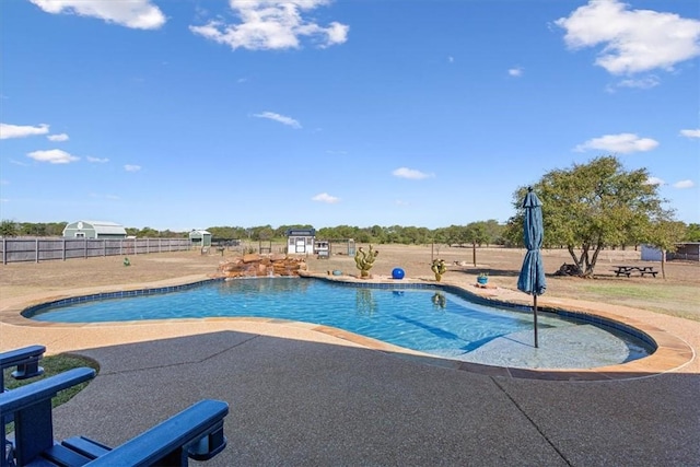 view of pool featuring a patio