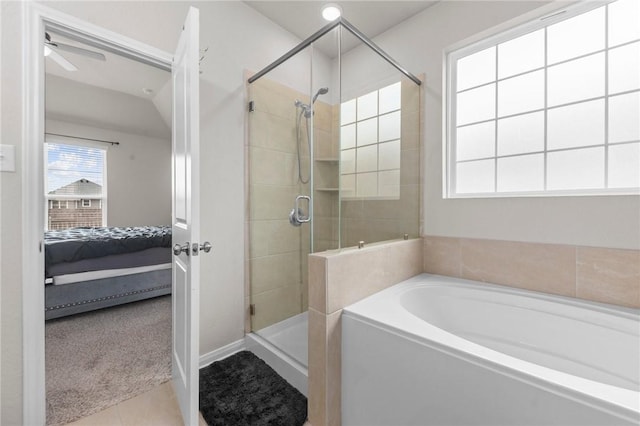 ensuite bathroom featuring ensuite bathroom, ceiling fan, a shower stall, a bath, and tile patterned floors