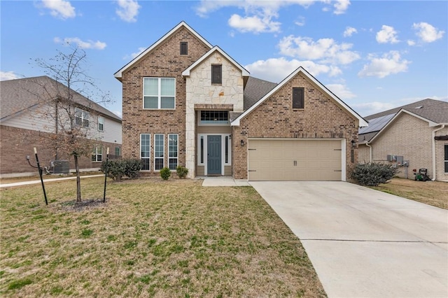 traditional home featuring brick siding, concrete driveway, a garage, stone siding, and a front lawn