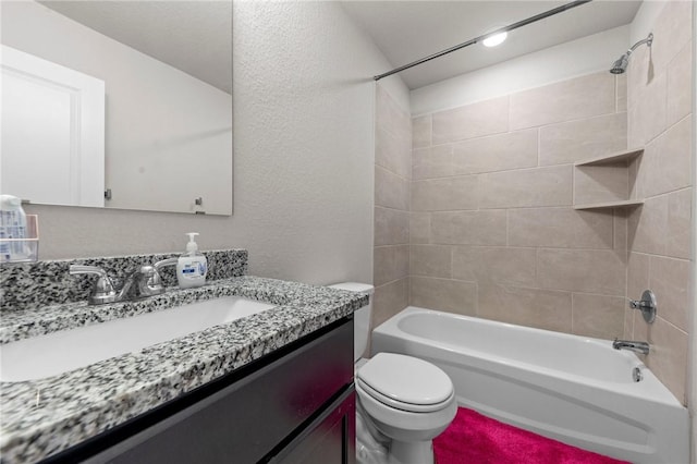 full bathroom featuring toilet, bathing tub / shower combination, and vanity