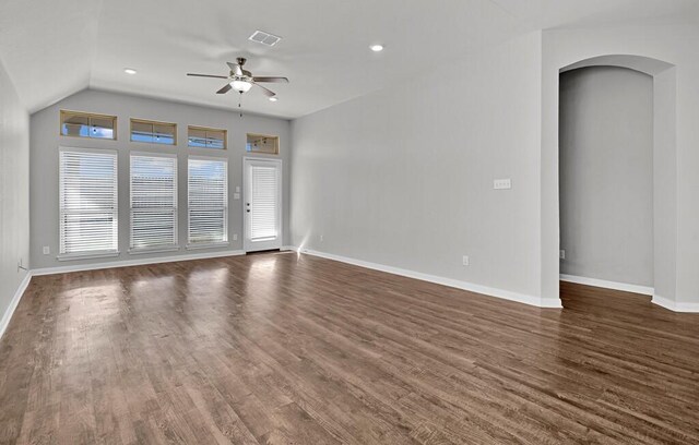 spare room featuring ceiling fan, dark hardwood / wood-style flooring, and lofted ceiling