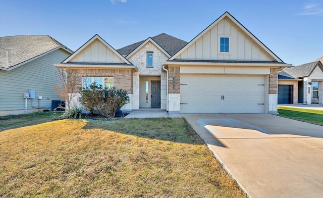 view of front of property featuring brick siding, board and batten siding, a garage, driveway, and a front lawn