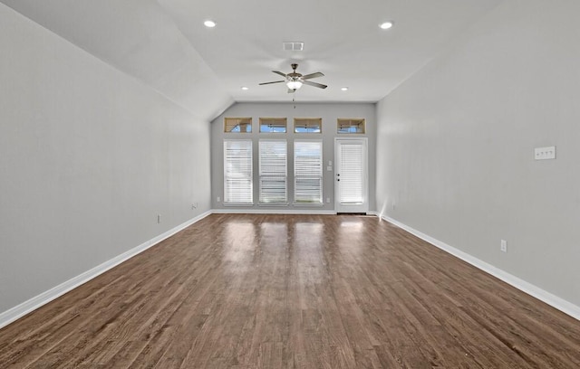 unfurnished living room featuring dark hardwood / wood-style floors, vaulted ceiling, and ceiling fan