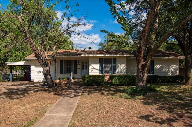 single story home featuring a carport