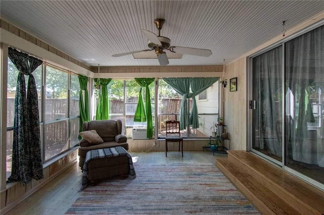 sunroom with ceiling fan and cooling unit