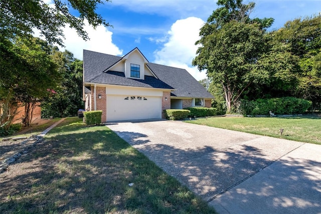 view of front of property featuring a front lawn and a garage