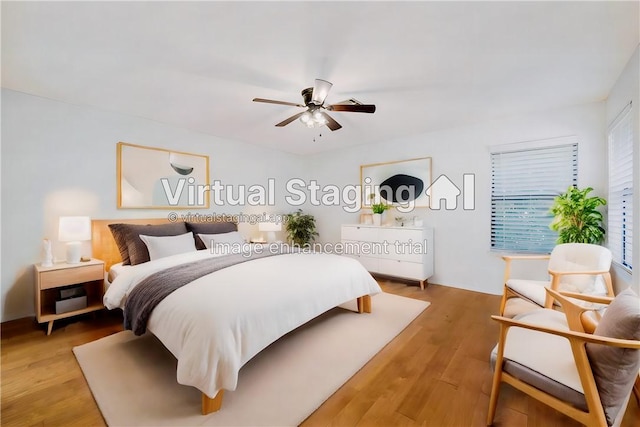 bedroom featuring hardwood / wood-style flooring and ceiling fan