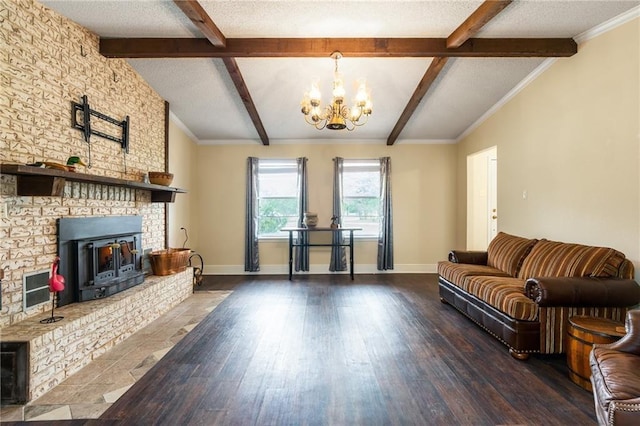 living room featuring lofted ceiling with beams, baseboards, a textured ceiling, and wood finished floors