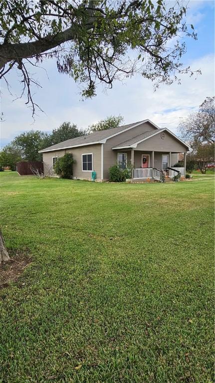 ranch-style home featuring a front yard