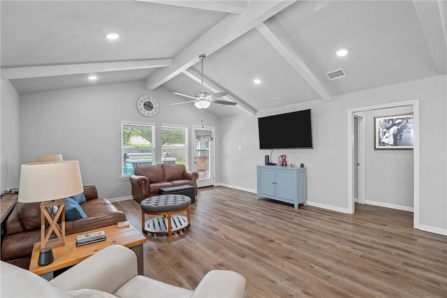 living room featuring hardwood / wood-style floors, lofted ceiling with beams, and ceiling fan