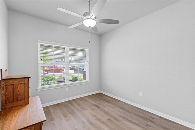 empty room featuring light hardwood / wood-style flooring and ceiling fan