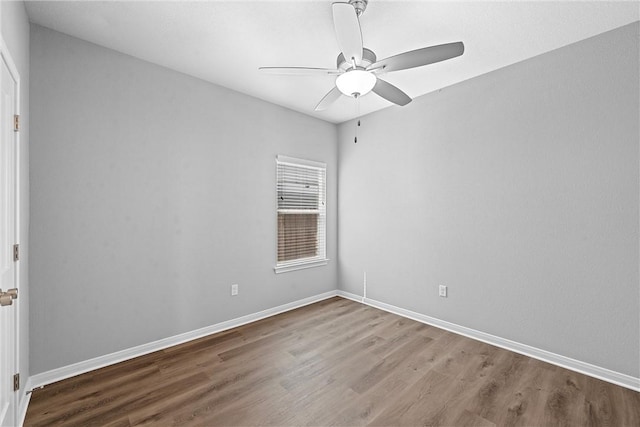 unfurnished room with ceiling fan and wood-type flooring