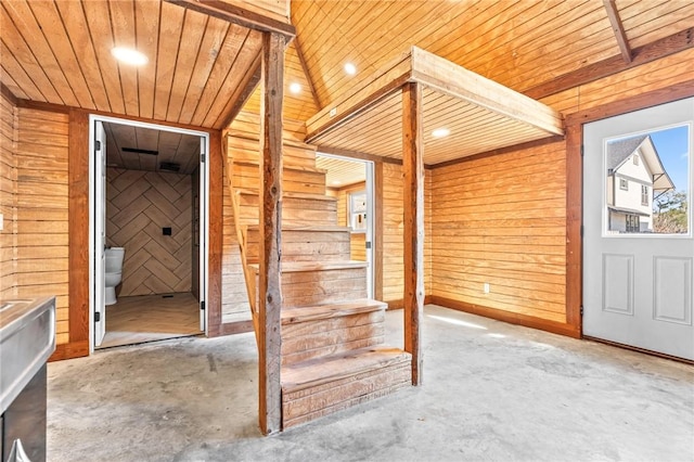 interior space with wood walls and wood ceiling