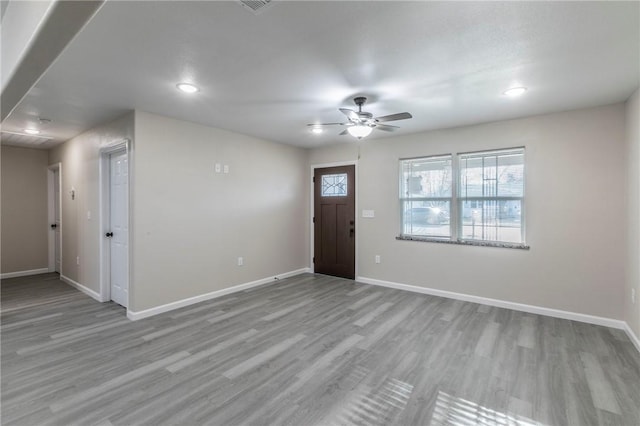 foyer featuring ceiling fan and light wood-type flooring