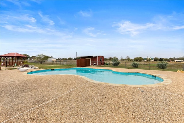 view of swimming pool featuring a gazebo and a patio area