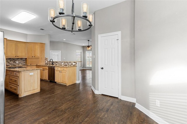 kitchen featuring light brown cabinets, light stone counters, dark hardwood / wood-style flooring, kitchen peninsula, and pendant lighting