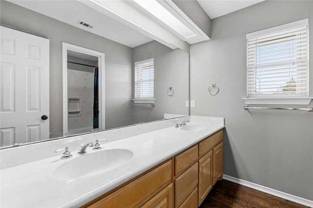 bathroom with vanity and hardwood / wood-style flooring