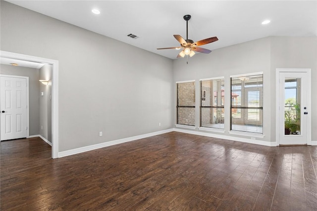 spare room featuring dark hardwood / wood-style flooring and ceiling fan