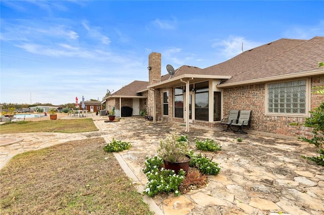 back of property with a patio area