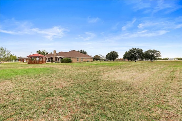 view of yard with a gazebo and a rural view