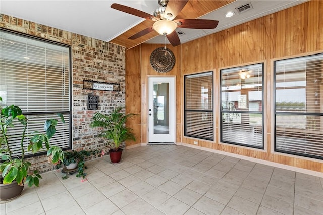 view of exterior entry with ceiling fan