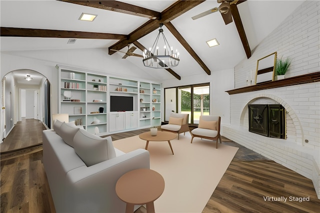 living room featuring a chandelier, vaulted ceiling with beams, a brick fireplace, and dark wood-type flooring