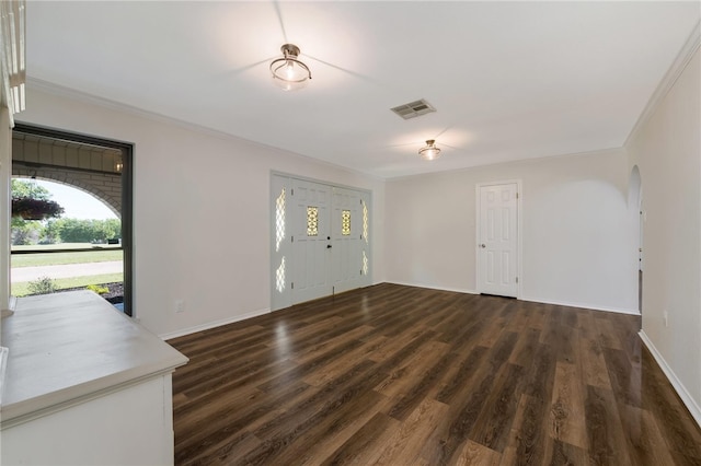 interior space featuring ornamental molding and dark wood-type flooring