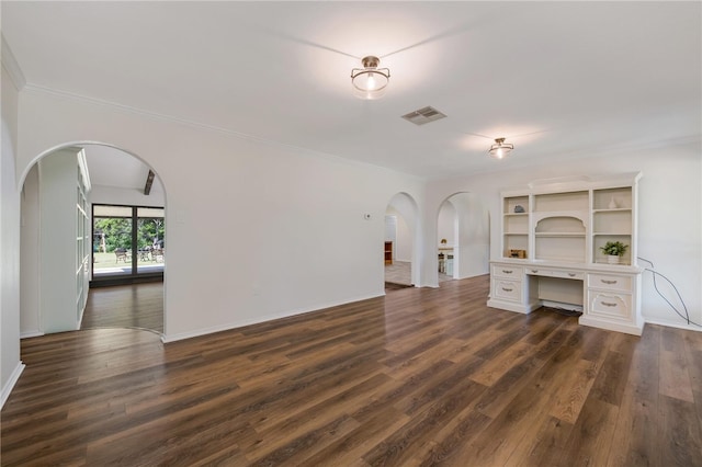 unfurnished living room with dark hardwood / wood-style floors and crown molding