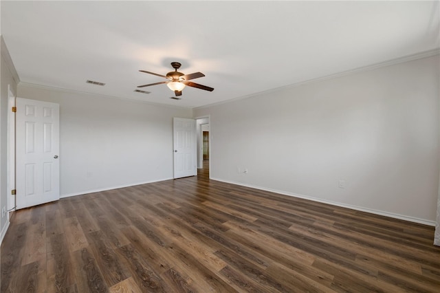 unfurnished room with crown molding and dark wood-type flooring