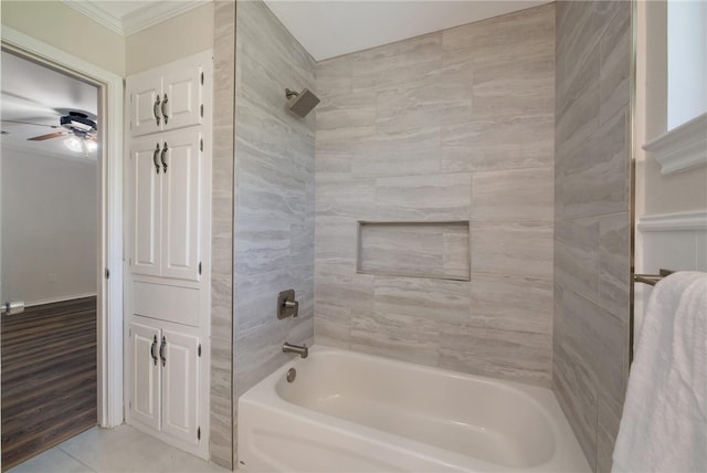 bathroom featuring tiled shower / bath combo, wood-type flooring, and ornamental molding