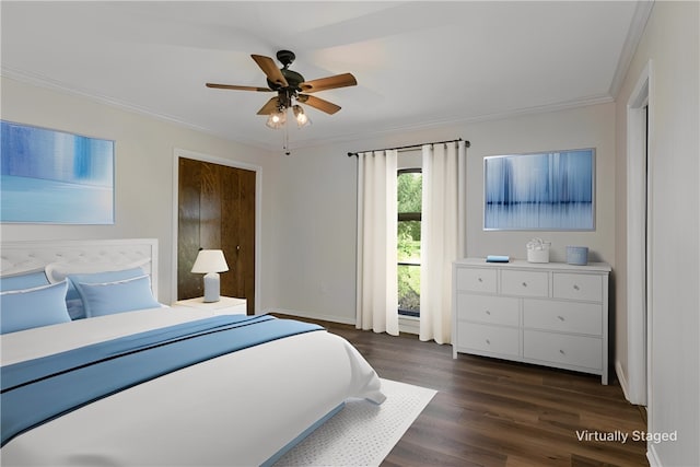 bedroom featuring dark hardwood / wood-style floors, ceiling fan, and ornamental molding