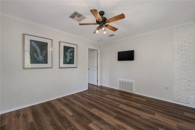 empty room featuring ceiling fan, ornamental molding, and dark wood-type flooring