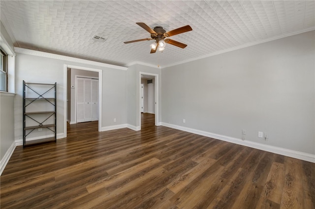 unfurnished bedroom featuring dark hardwood / wood-style flooring, ceiling fan, and crown molding