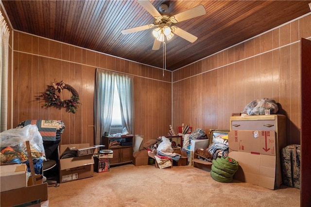 misc room with ceiling fan, wood walls, carpet floors, and wooden ceiling