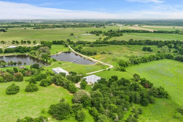 aerial view featuring a rural view and a water view