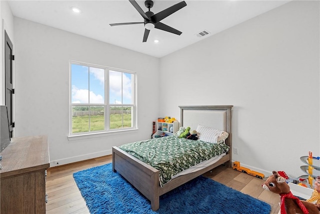 bedroom featuring ceiling fan and light hardwood / wood-style floors