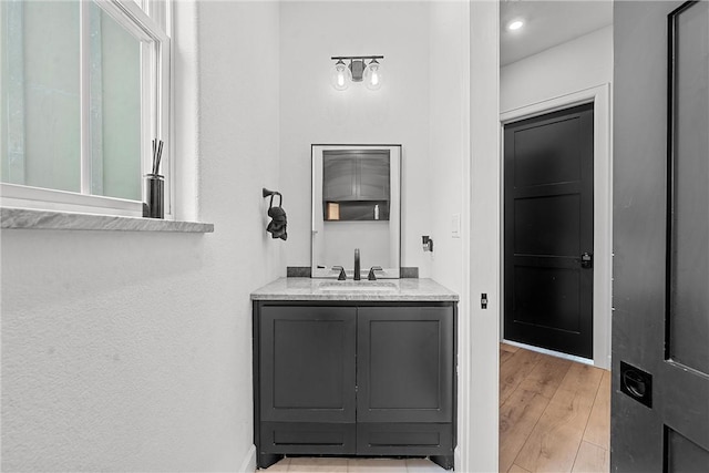 bathroom featuring hardwood / wood-style floors and vanity