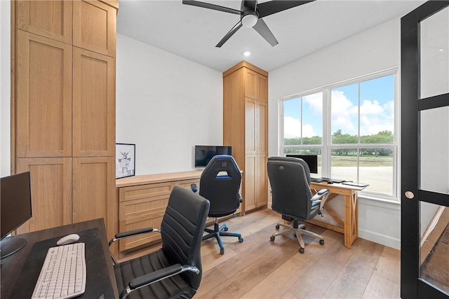 office featuring light wood-type flooring and ceiling fan