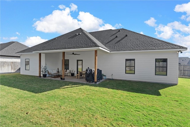 back of house featuring a lawn, ceiling fan, outdoor lounge area, and a patio