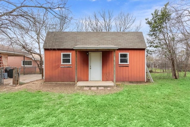 view of outbuilding with an outbuilding and fence